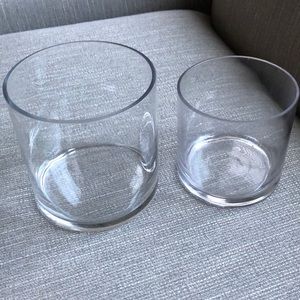 Set of 2 round glass vases. 5” and 6” in diameter